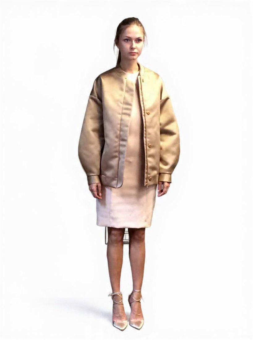 A champagne satin bomber jacket over a blush dress, designed by Federica Cavenati