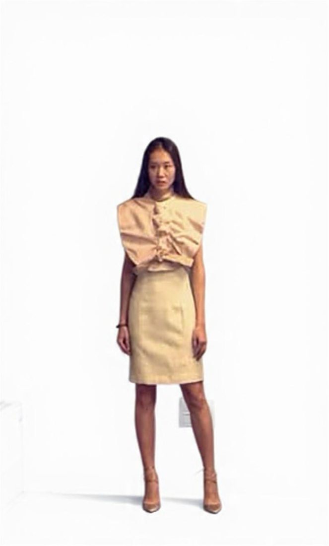 A pale ruffled top with a matching skirt, designed by Federica Cavenati